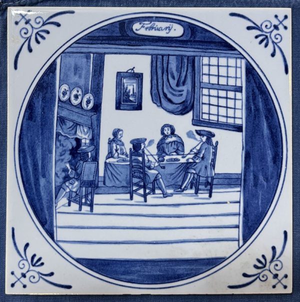 blue and white delft tile with illustration of 5 people sitting around a table smoking pipes in an interior scene